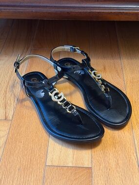 GBG Los Angeles Black T-Strap Sandals with Gold Chain Accent